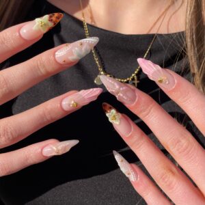 Shell theme with 3D effect, flowers, rhinestones, and pink nail art